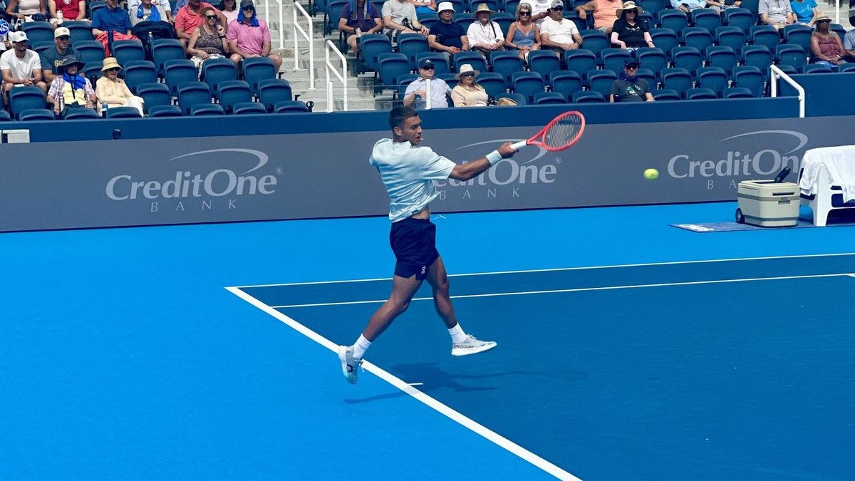 Flavio Cobolli hitting a backhand at the Cincinnati Open