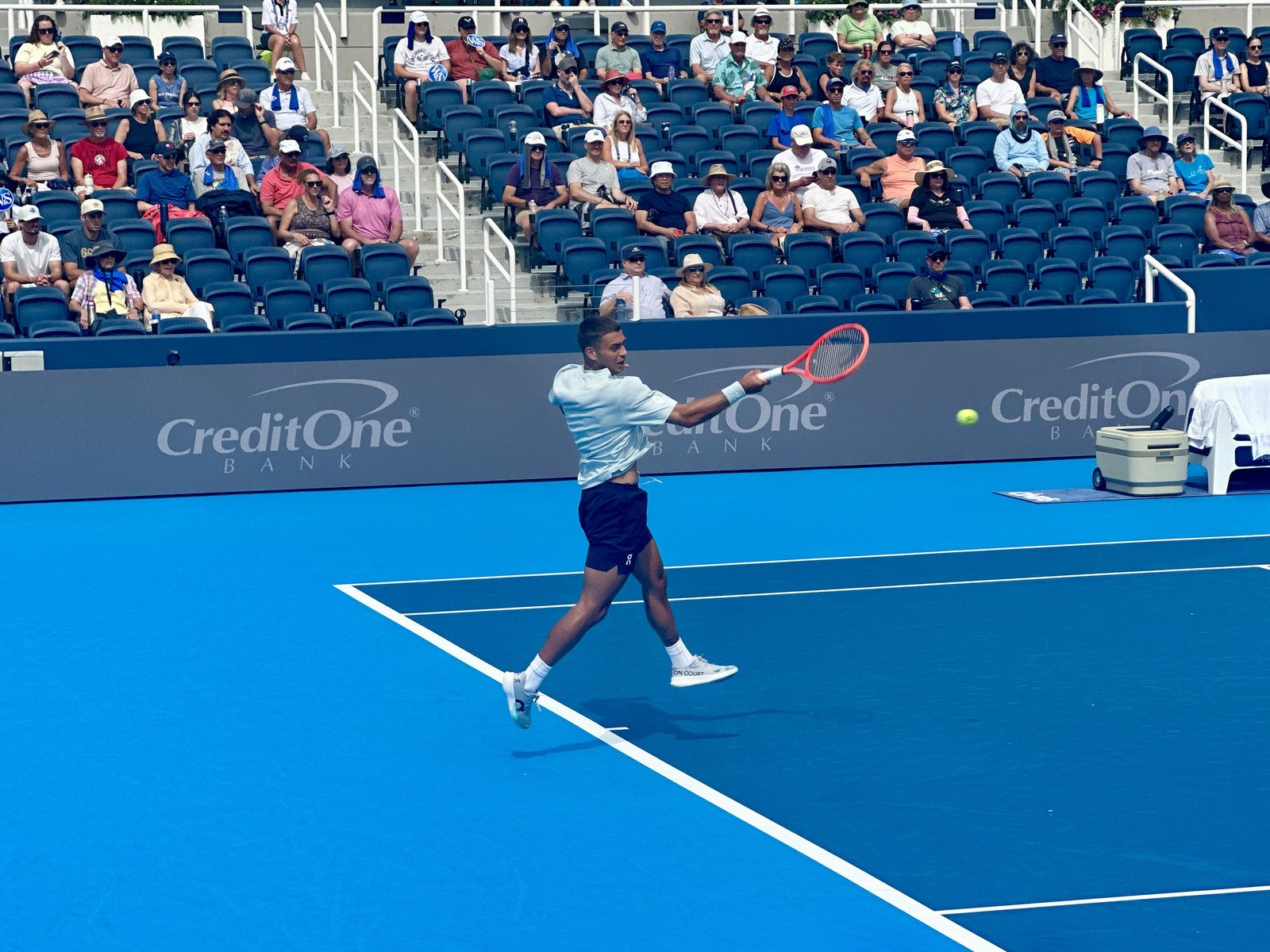 Flavio Cobolli hitting a backhand at the Cincinnati Open