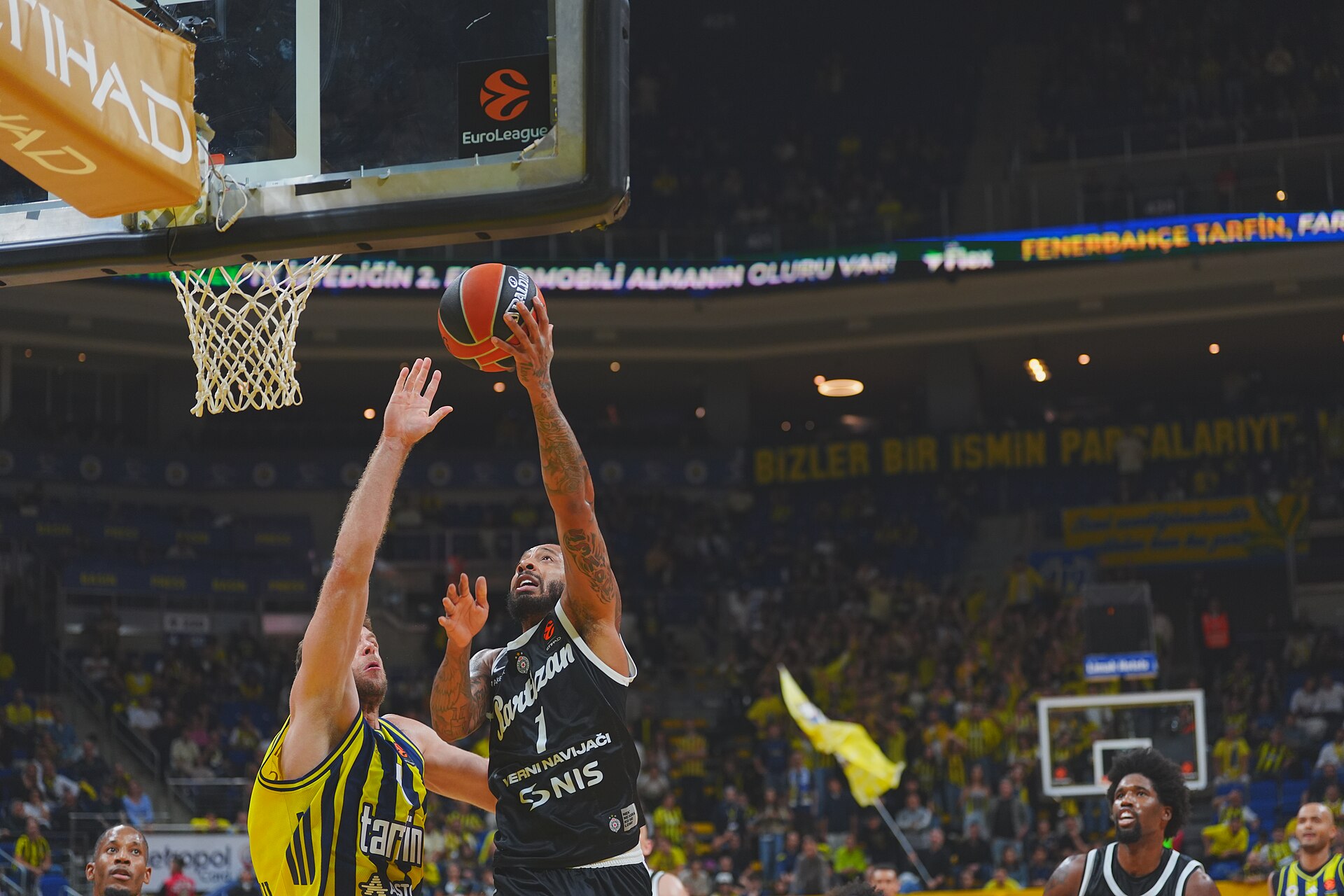 Carlik Jones of Partizan Belgrade finishing at the rim in a EuroLeague game