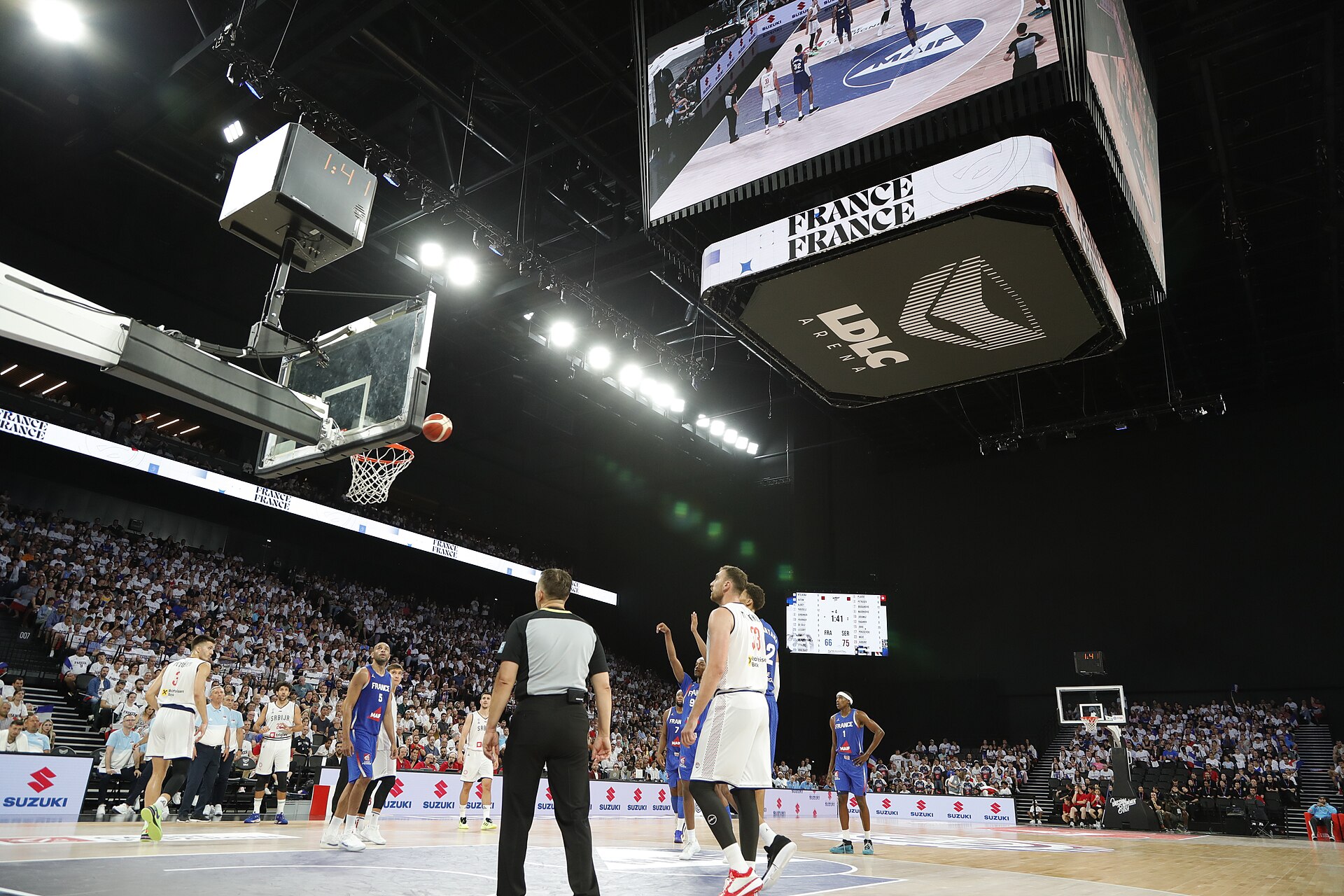 Inside LDLC Arena in Lyon during a basketball game, with a packed crowd