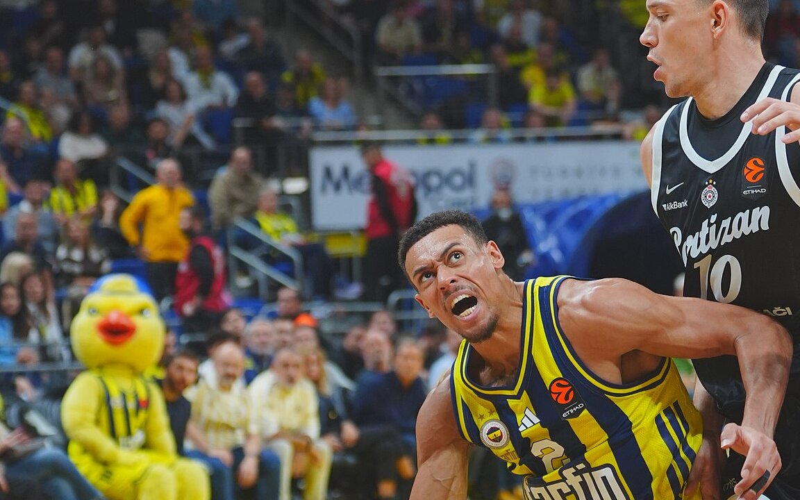 Wade Baldwin IV of Fenerbahce Istanbul driving with the ball against a Partizan Belgrade defender