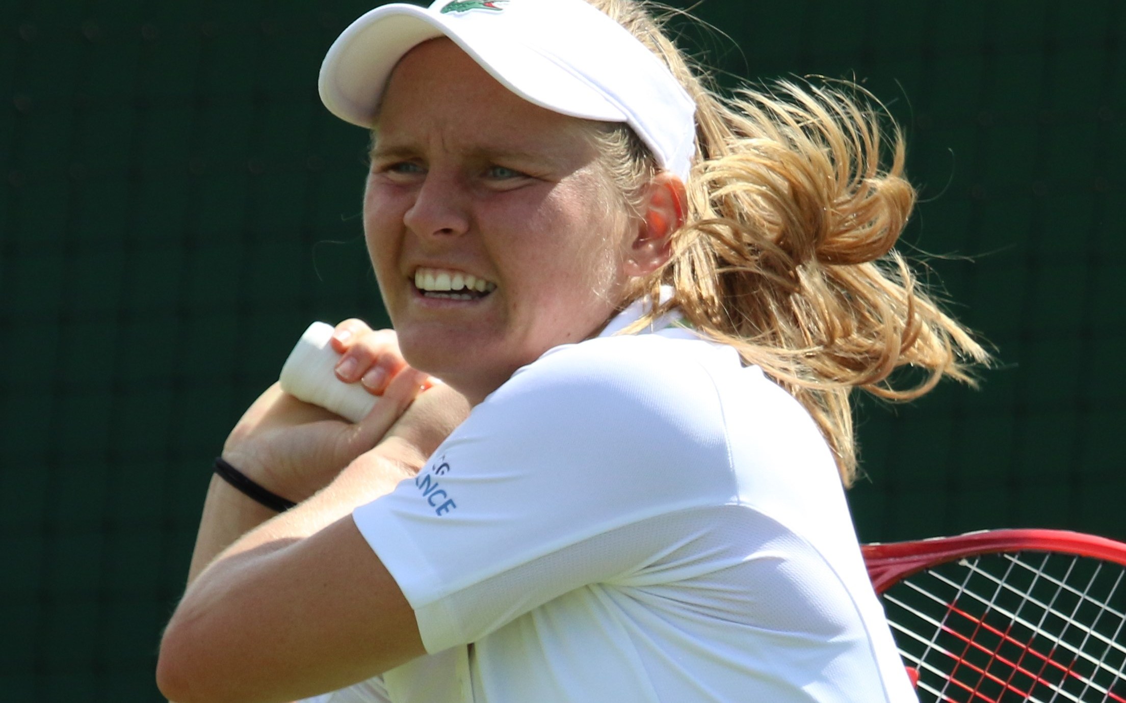Fiona Ferro hitting a two-handed backhand during Wimbledon qualifying
