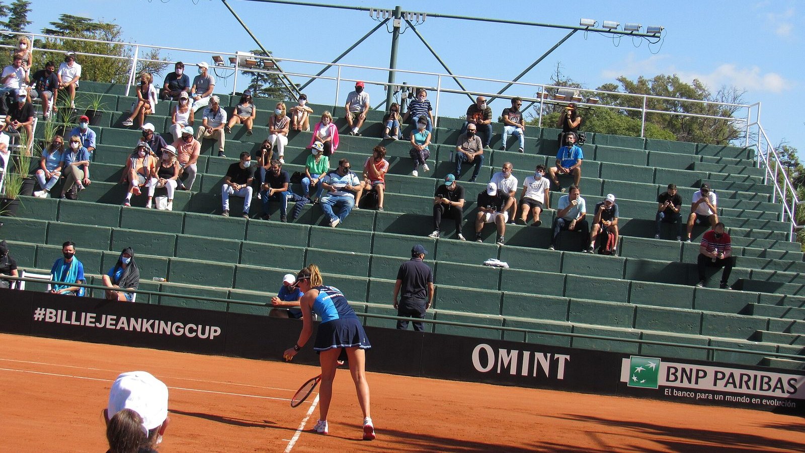 Nadia Podoroska preparing to return serve on a clay court at the Billie Jean King Cup in Cordoba